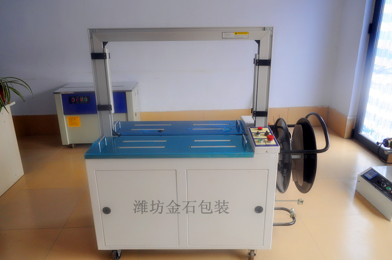 B-201A全自(zi)動桌面滾(gǔn)筒傳動型(xíng)打包機捆(kun)紮機