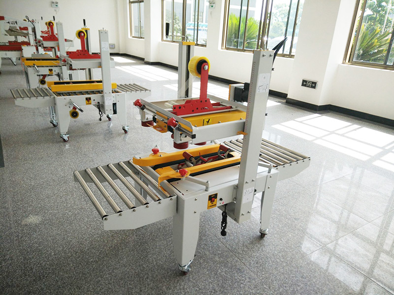 JS-FX500C 上下驅(qu)動手動折蓋膠(jiao)帶封箱機